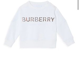 Kids Burberry shirt size 4 years which is the same size as a 4T